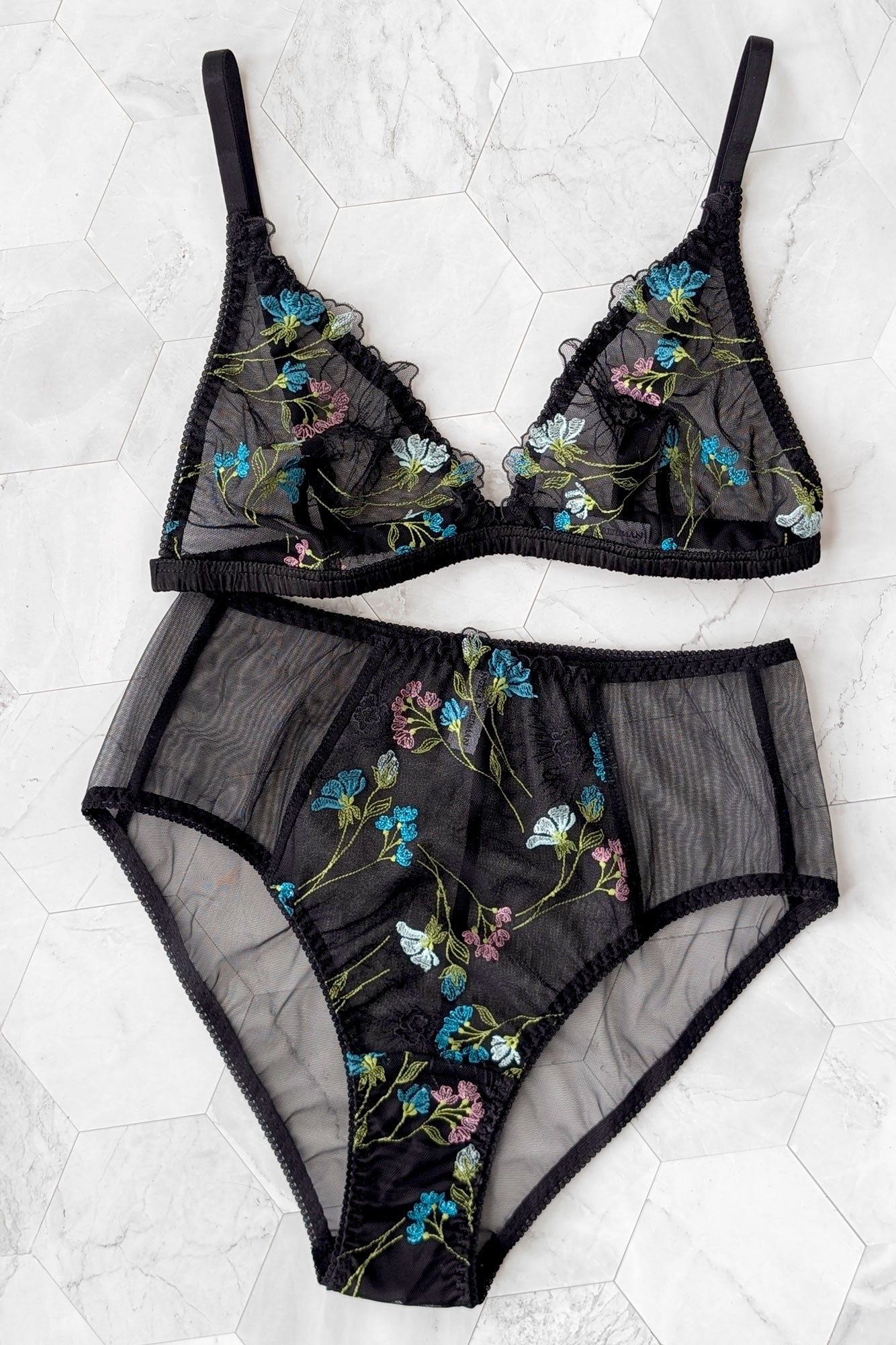 Black floral embroidered lingerie set including a wireless bralette with silk ruched band and a pair of high-waisted panties in black mesh
