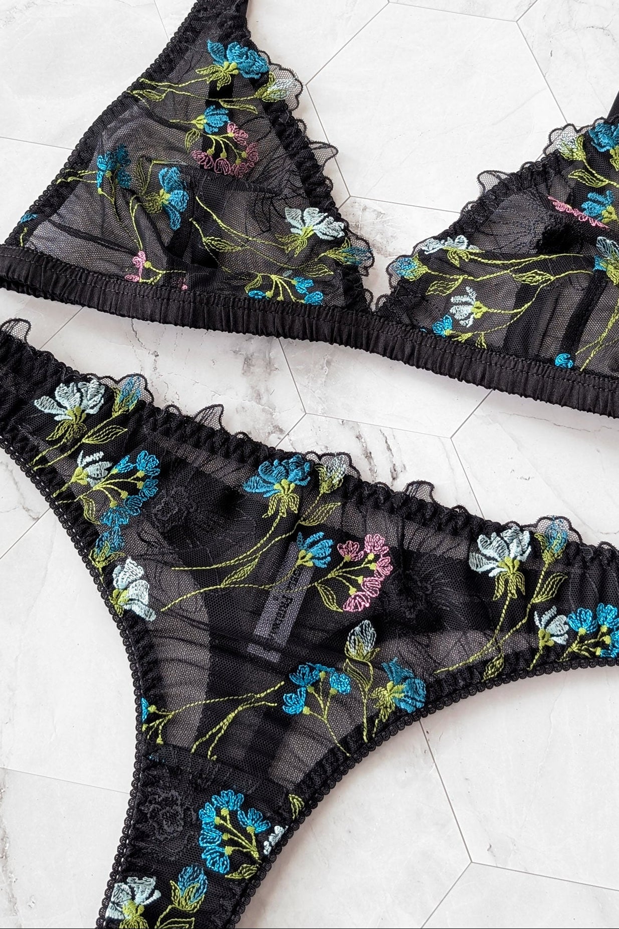 Floral embroidered lingerie set with a silk bra and colorful floral thong panty