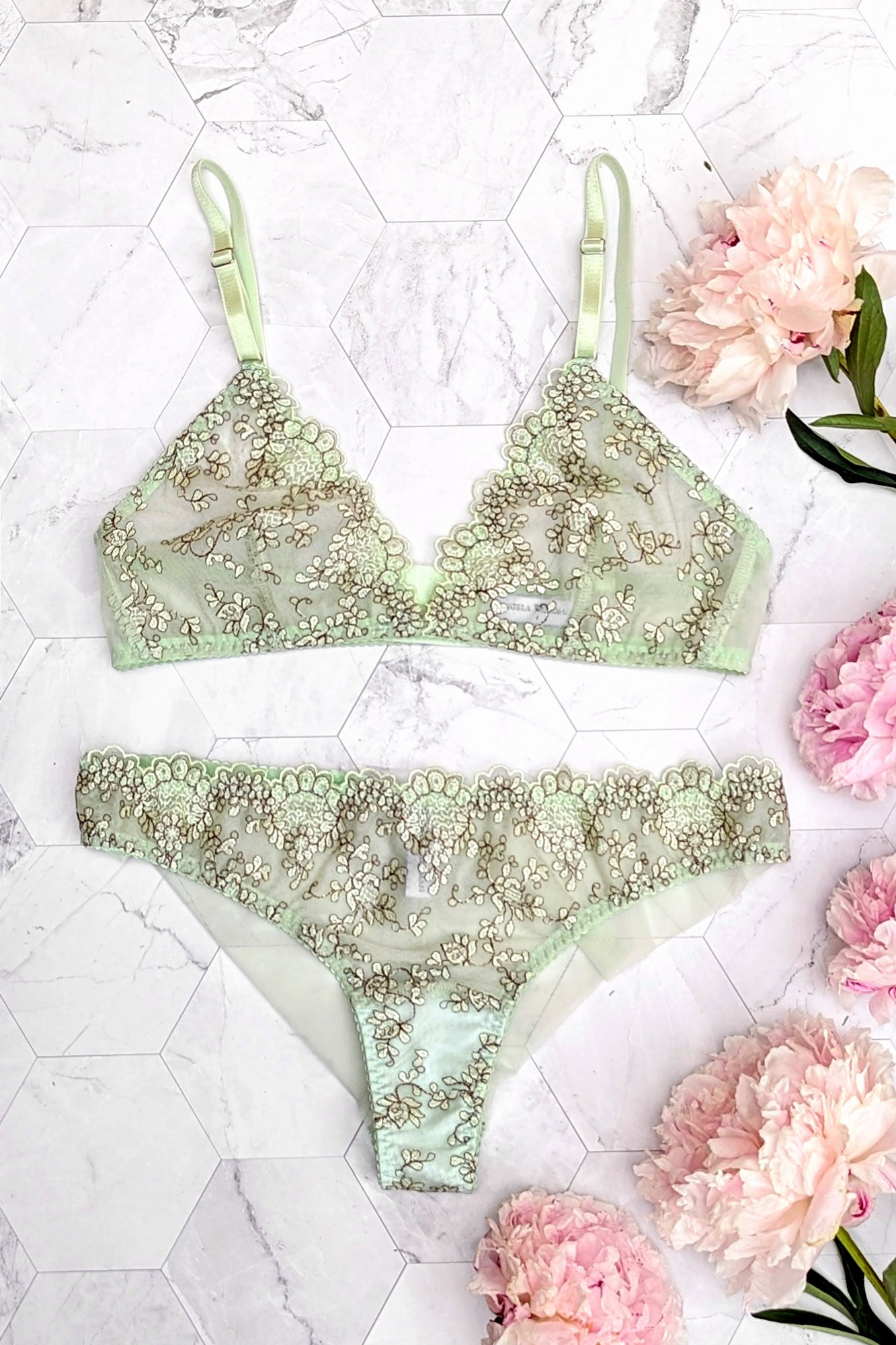 Green lace lingerie set with a wireless bra and cheeky knickers