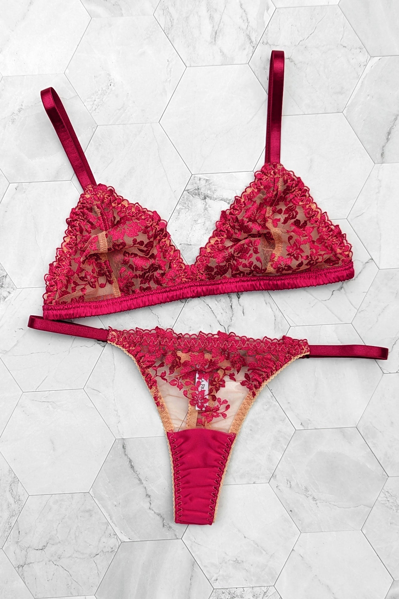 Red embroidered lingerie set with a silk thong
