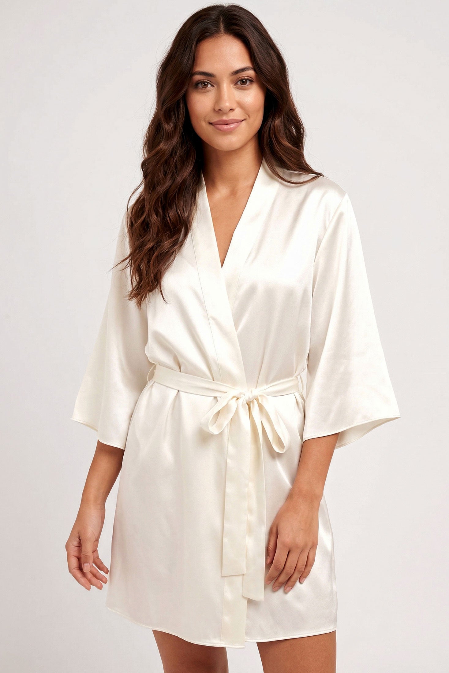 Bride wearing a silk satin robe for her wedding getting-ready look