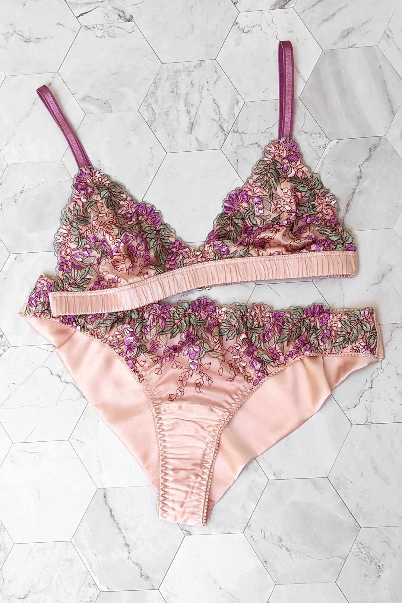 Luxury lingerie set in pink floral silk with ruched band and purple elastics