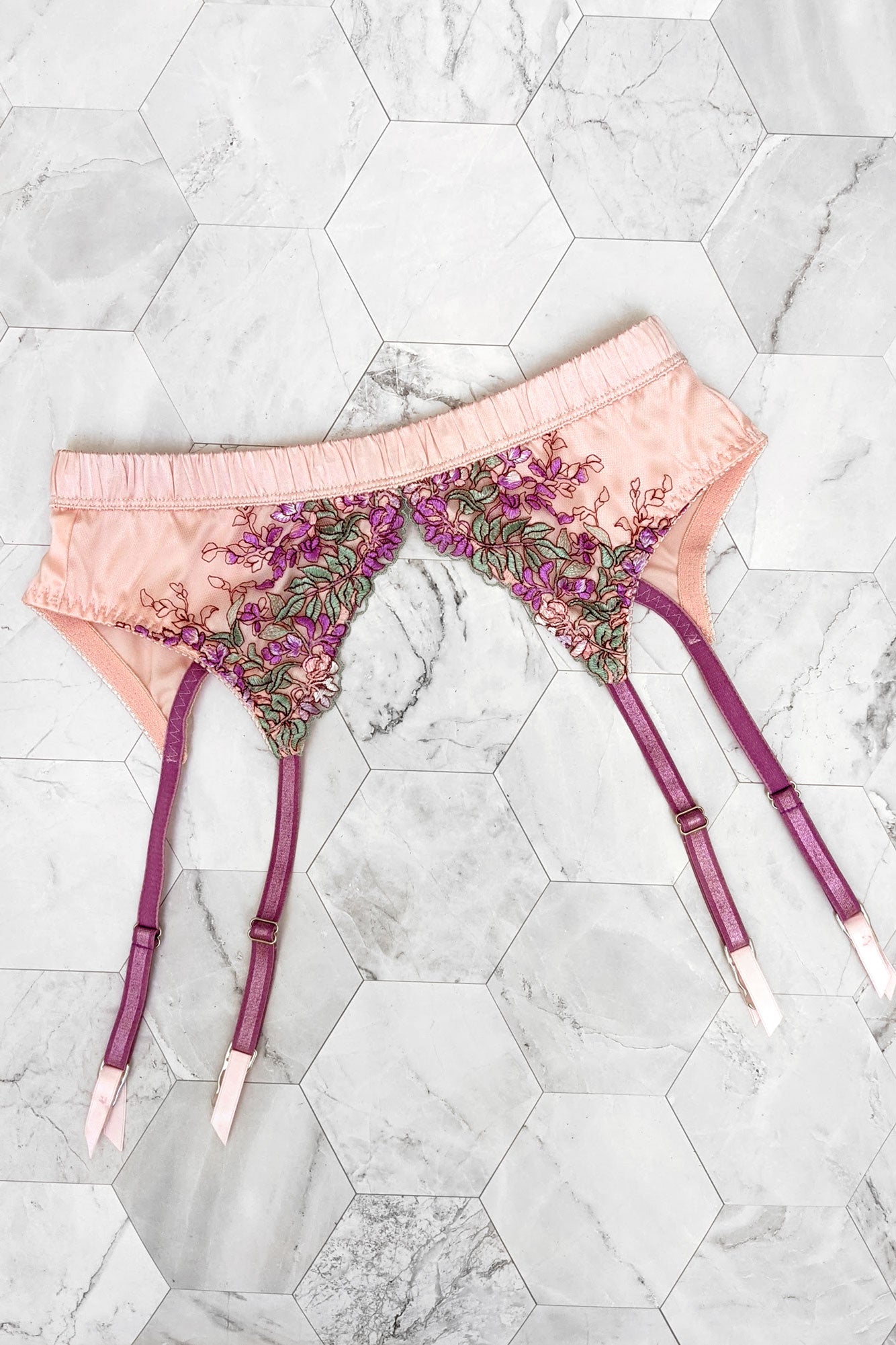 Pink and purple suspender belt with floral embroidery