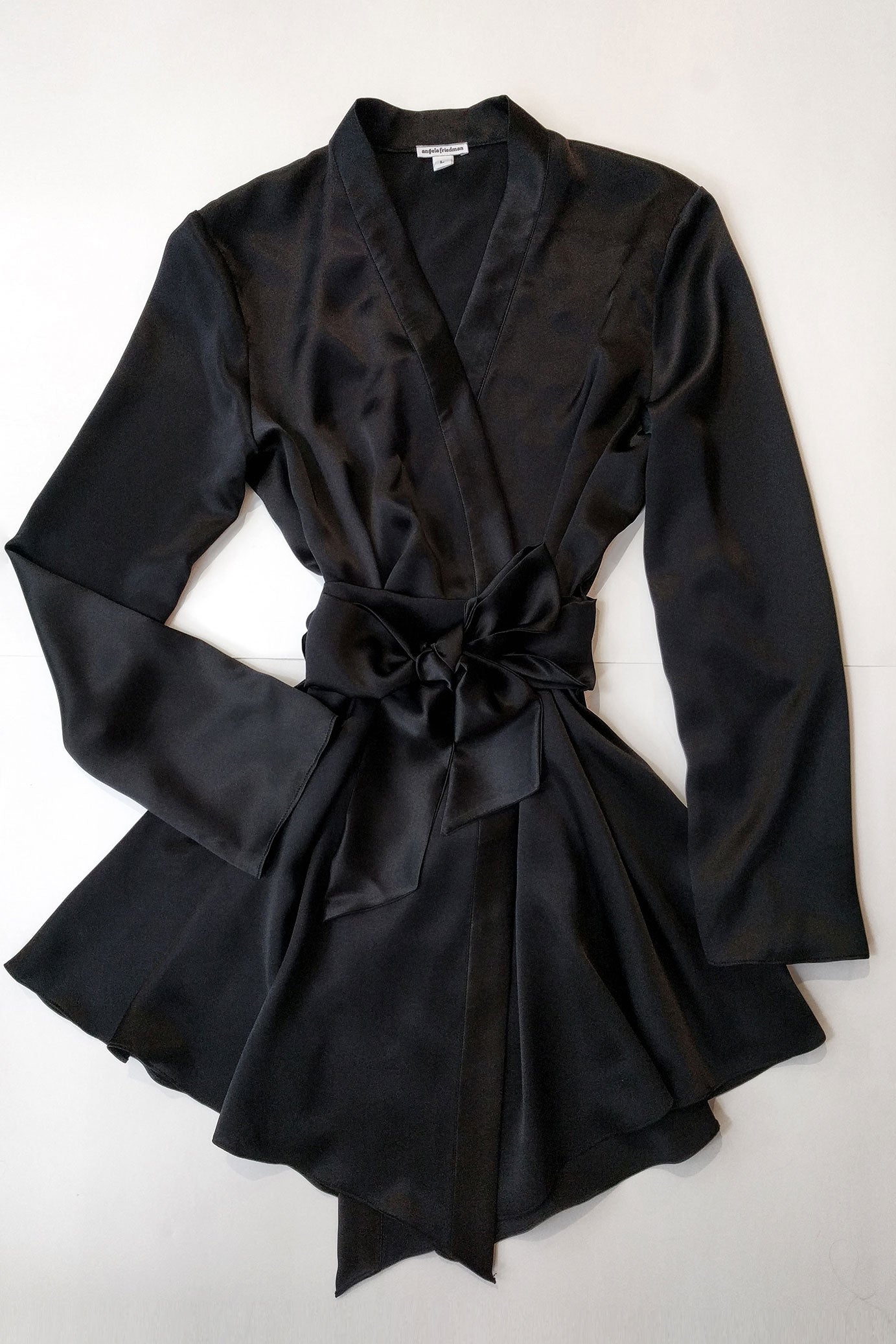 Handmade silk dressing gown in black satin with a large silk bow tied at the waist