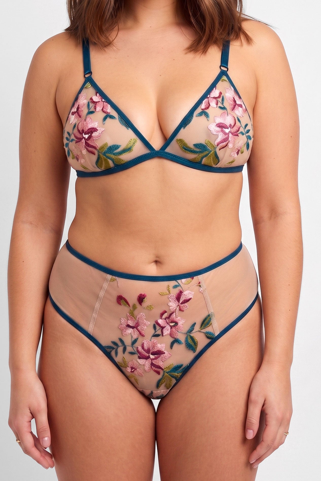 Closeup shot of a flowery lingerie set with a wire-free triangle bralet and hi-rise panties