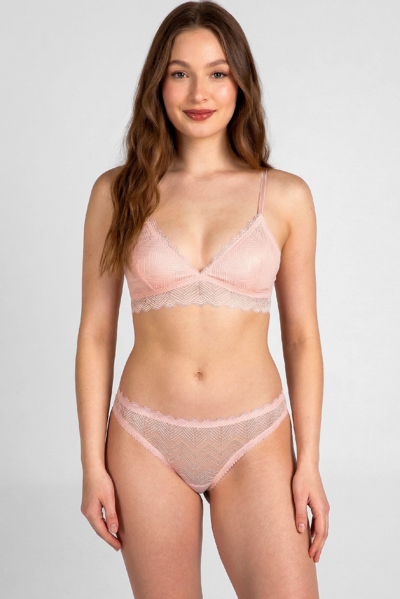 Designer lace lingerie set with pink silk linings and sheer panels