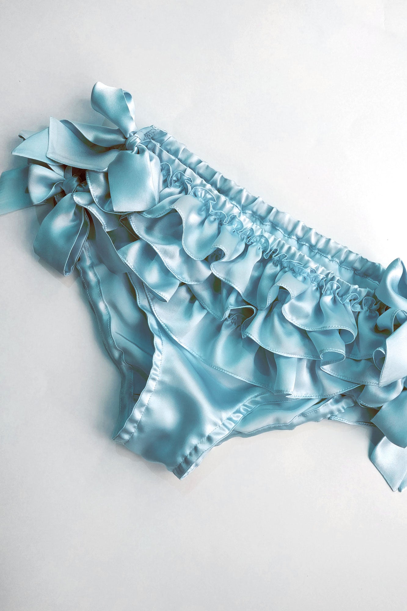 Silk ruffle panty with blue side tie bows and 3 ruffles