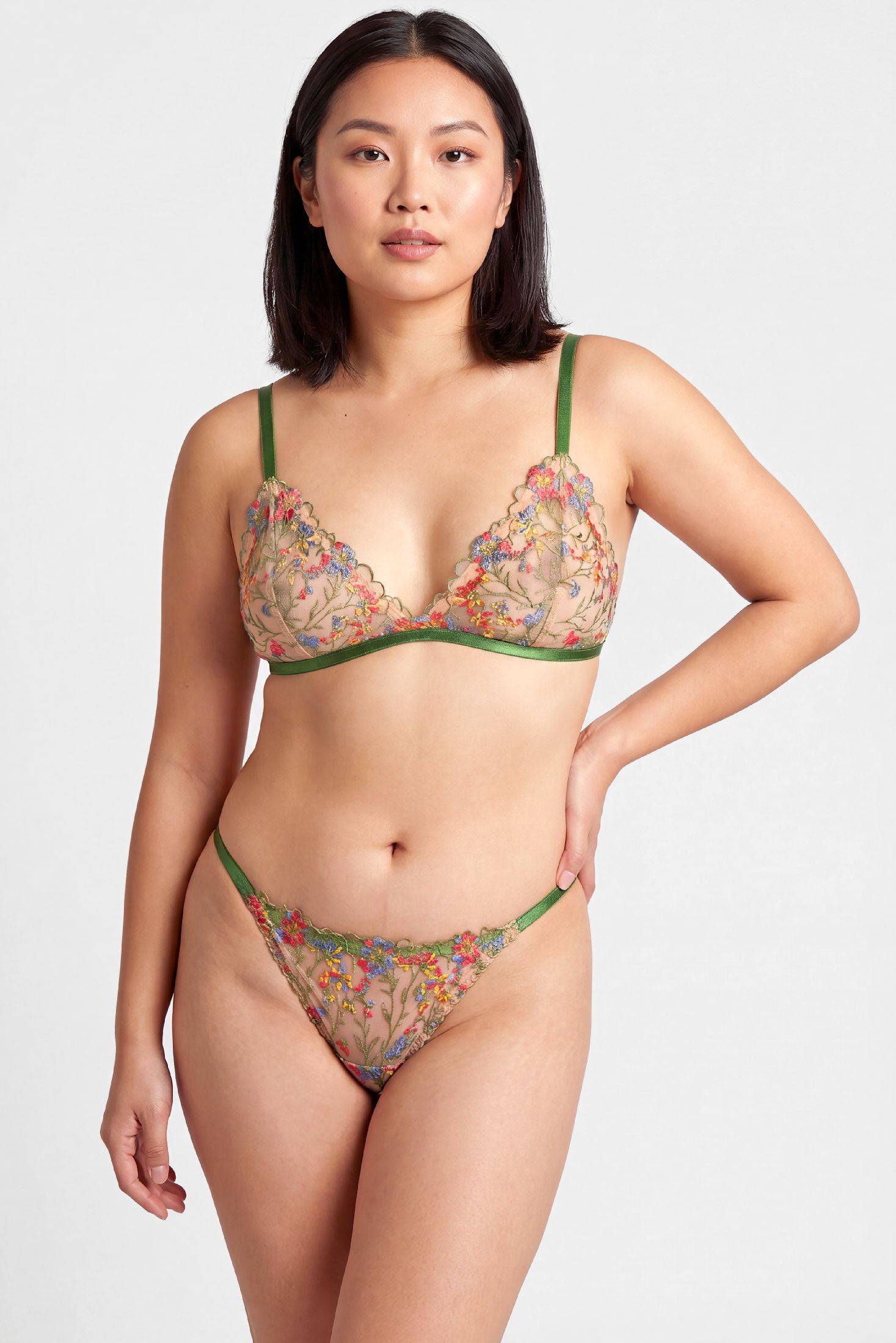 Floral designer lingerie set including a sheer embroidery bralet and strappy thong panties