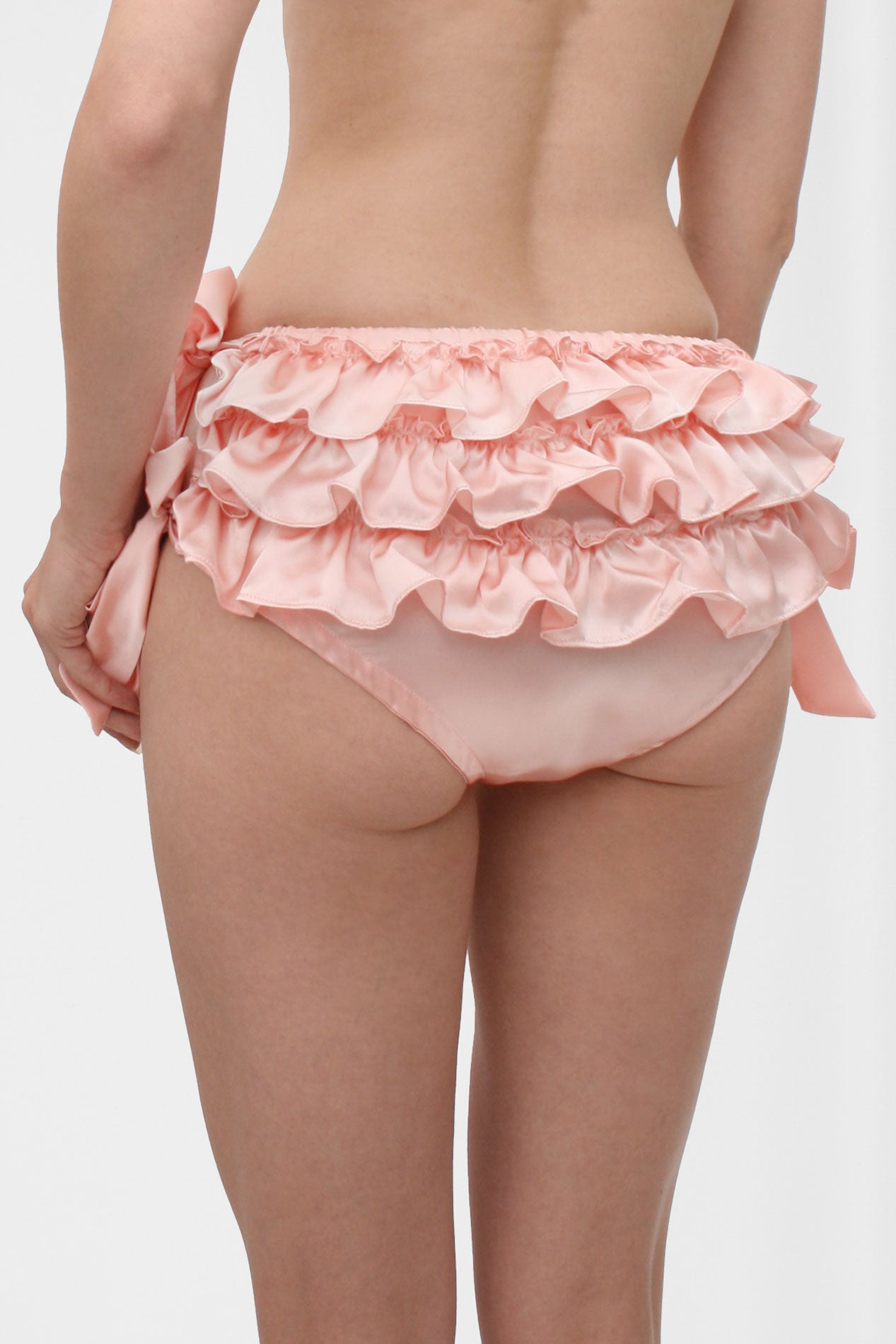Frilly pink silk underwear with ruffles on the back