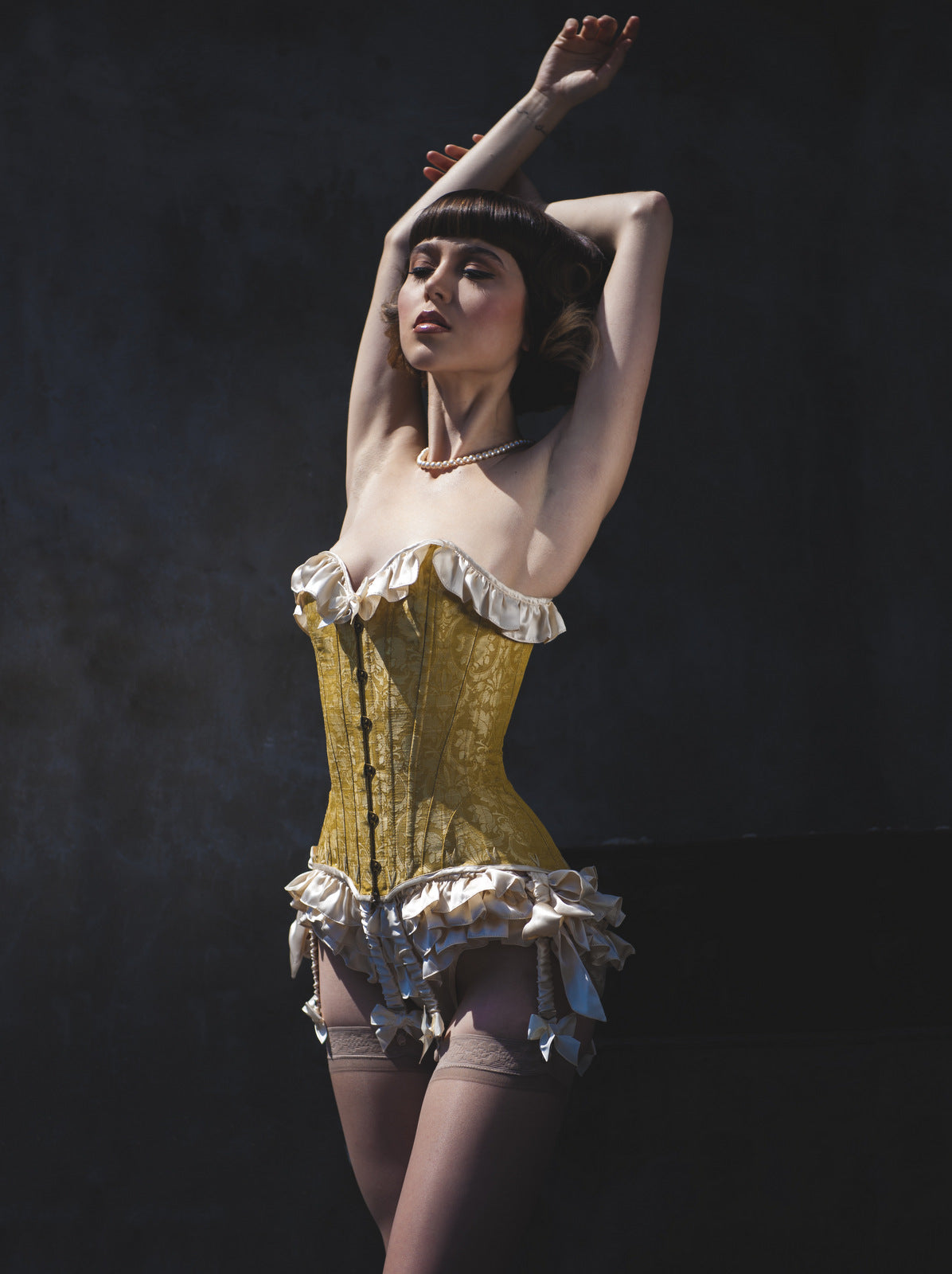 Retro luxury lingerie set with silk ruffled underwear and a gold brocade corset