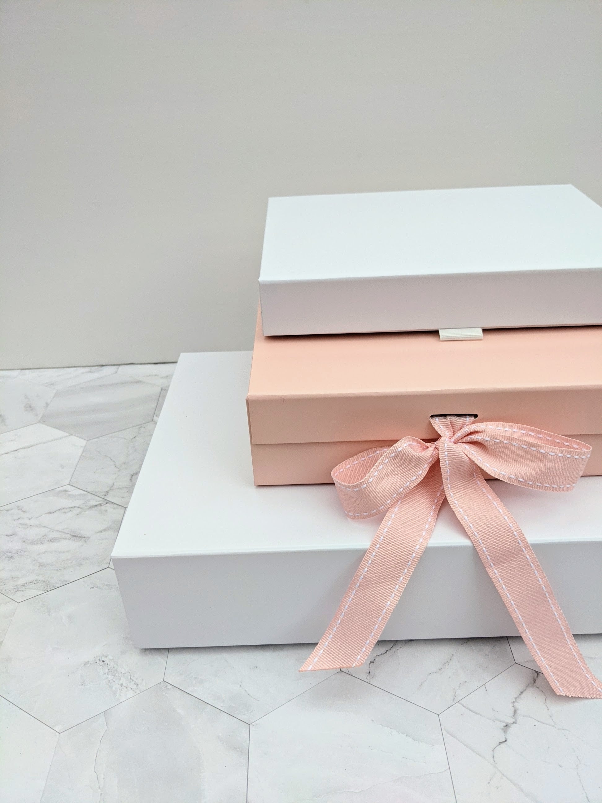 Luxury rigid gift boxes in pink and white for lingerie sets