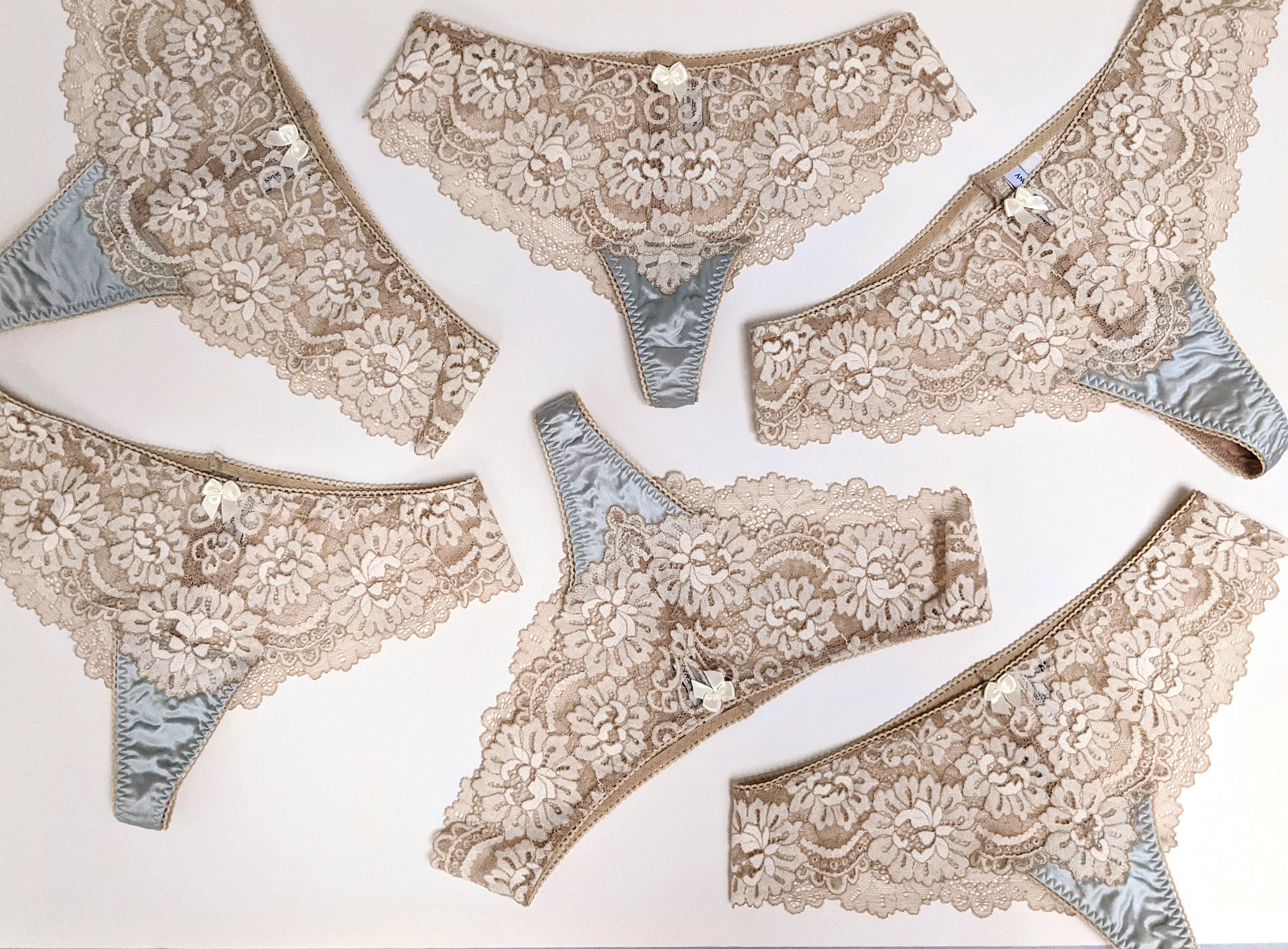 Cream and blue lace underwear and silk panties