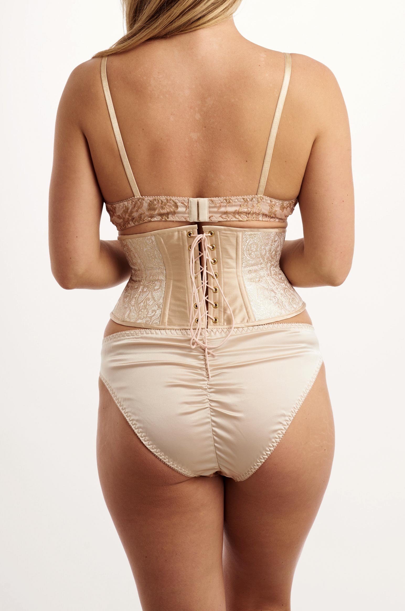 Vintage style underwear set in almond pink silk with a corset waist cincher