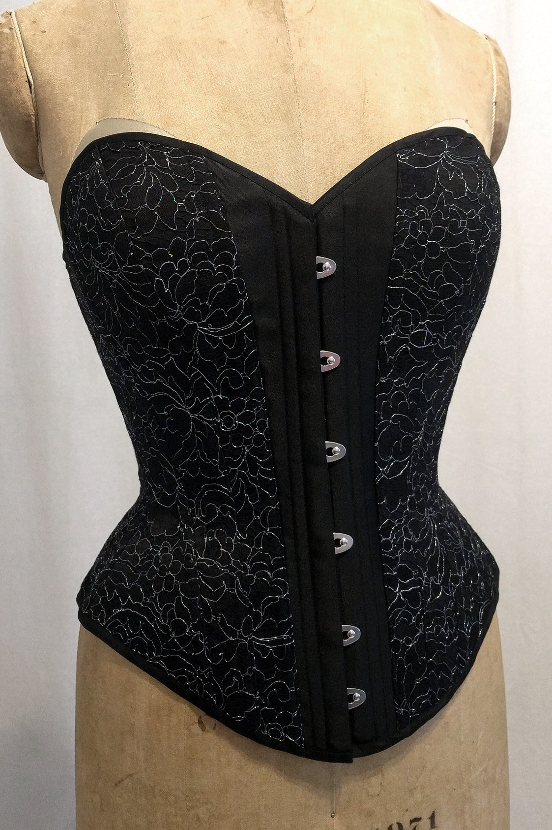 Black lace sweetheart corset in victorian silhouette with steel boning