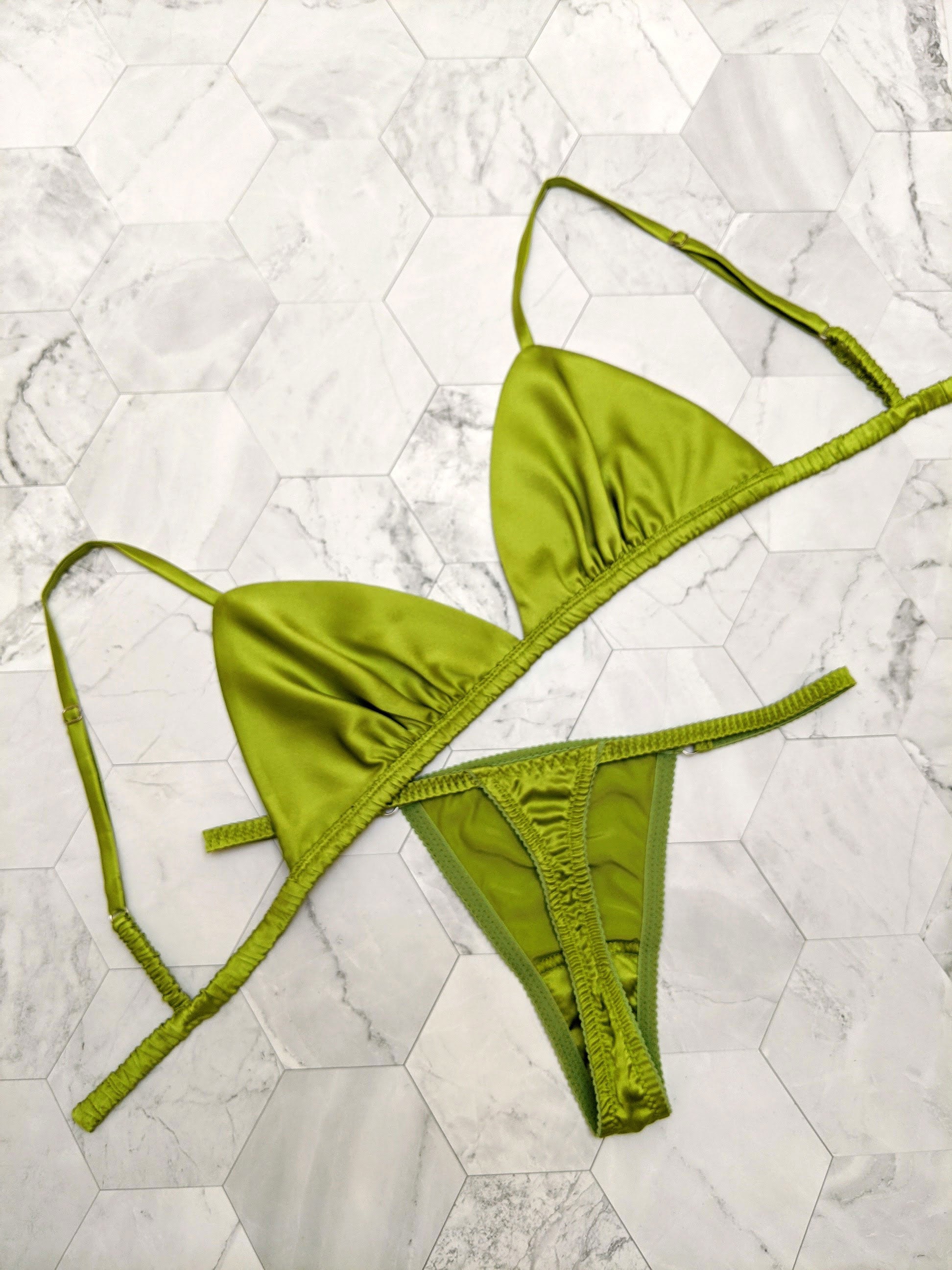 Flat lay of chartreuse green lingerie set in pure silk satin