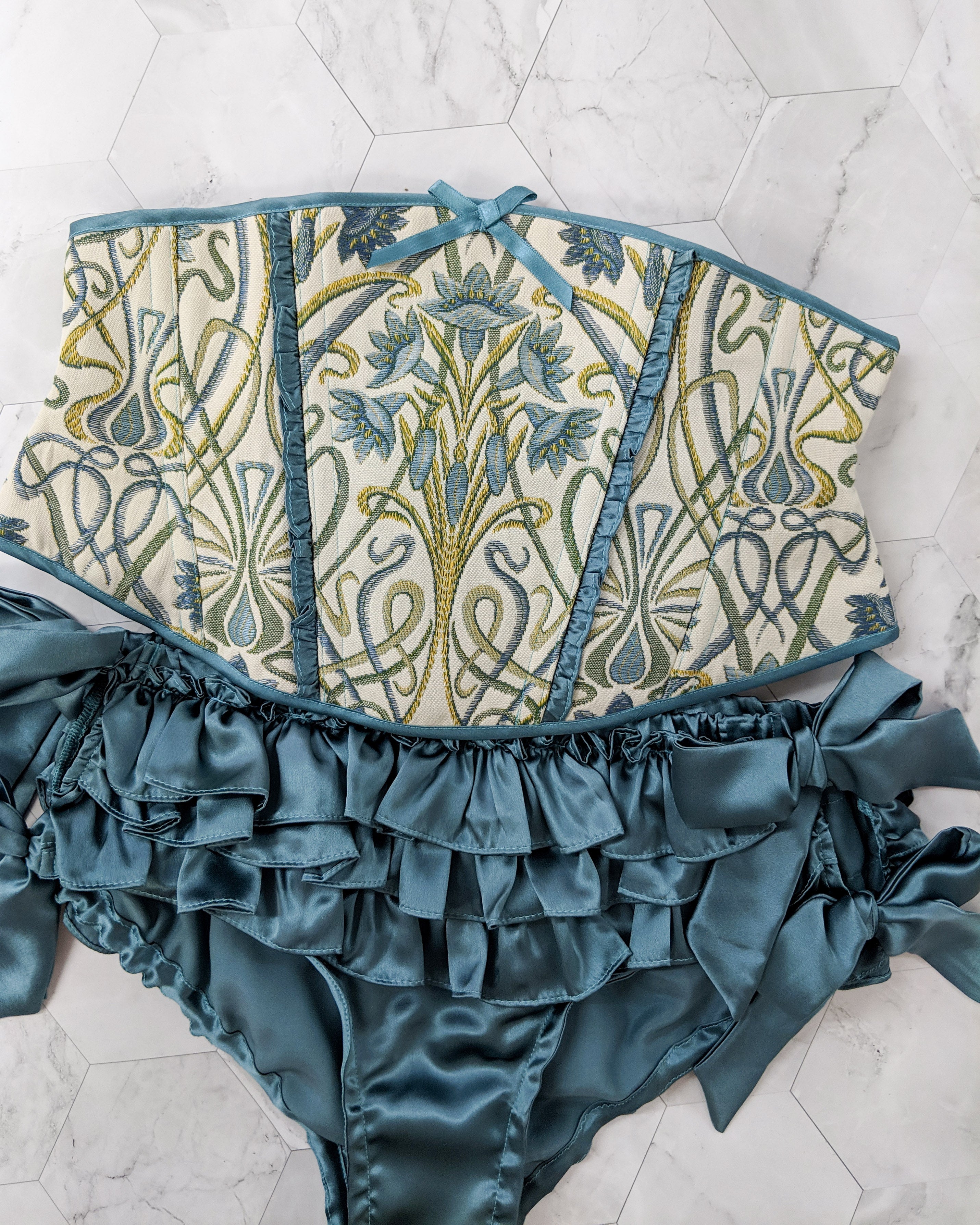 Designer intimates collection with handmade silk ruffled panties and a brocade waspie corset